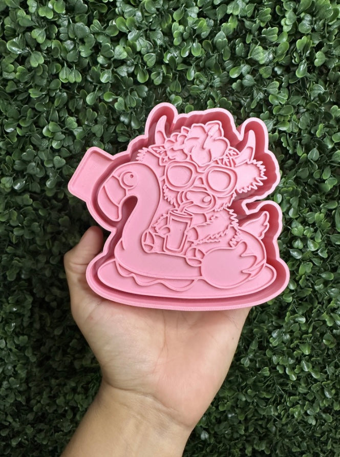 Cow on flamingo floatie
