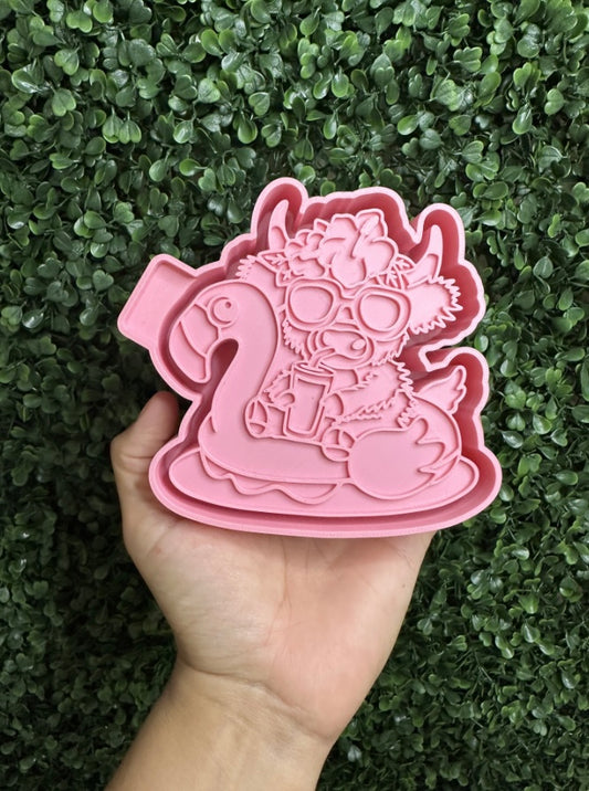Cow on flamingo floatie